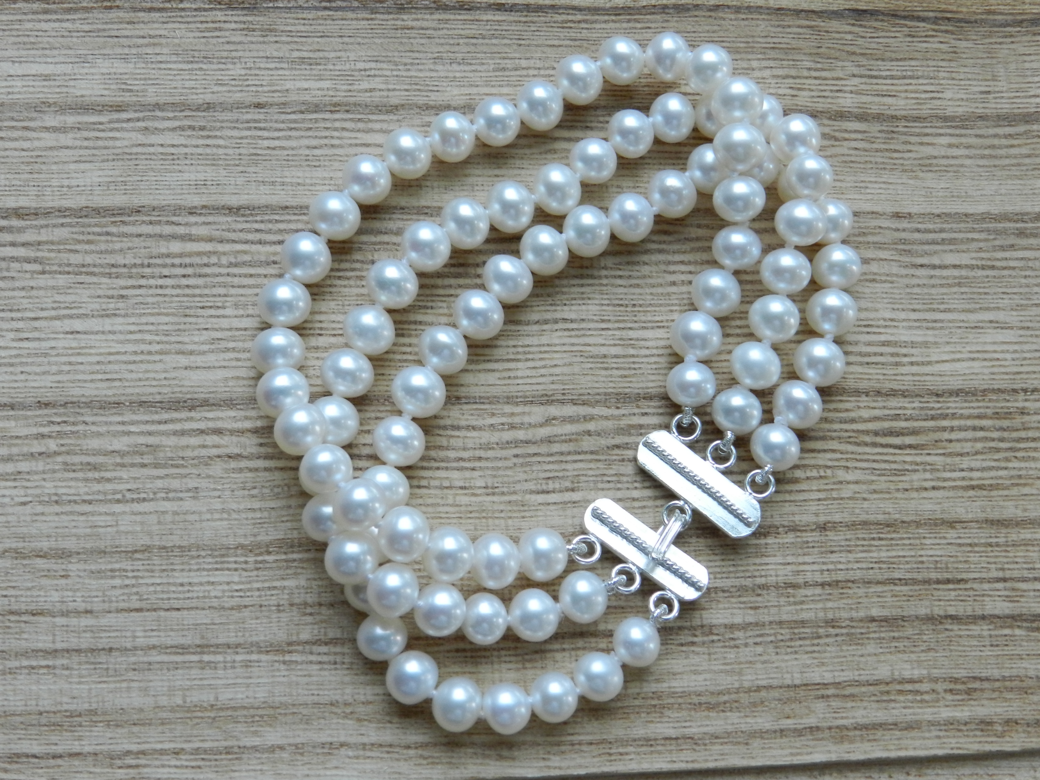 Double row pearl bracelet, clasp RG 585, ,consisting of … | Drouot.com